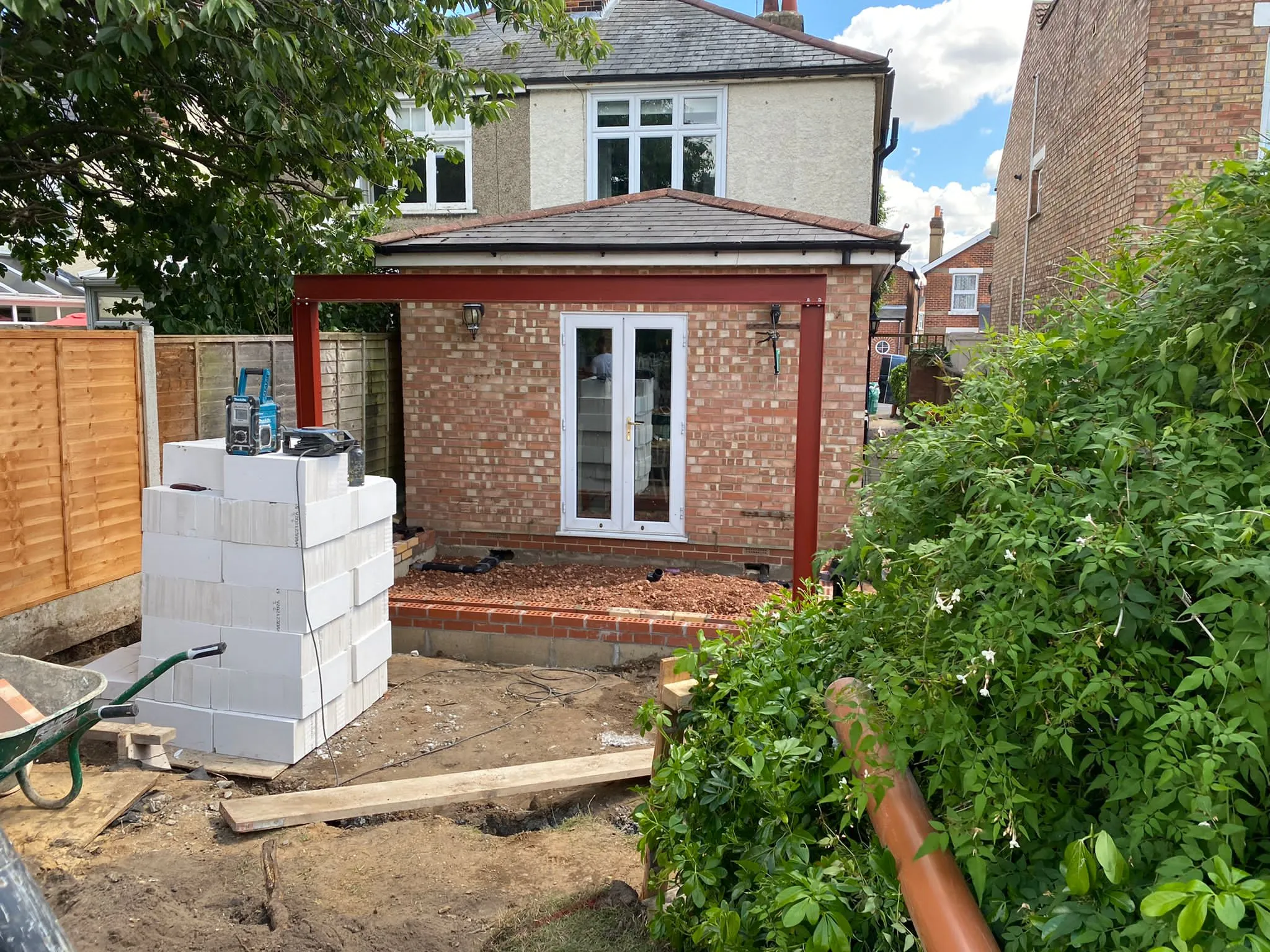 a house being built with a brick wall